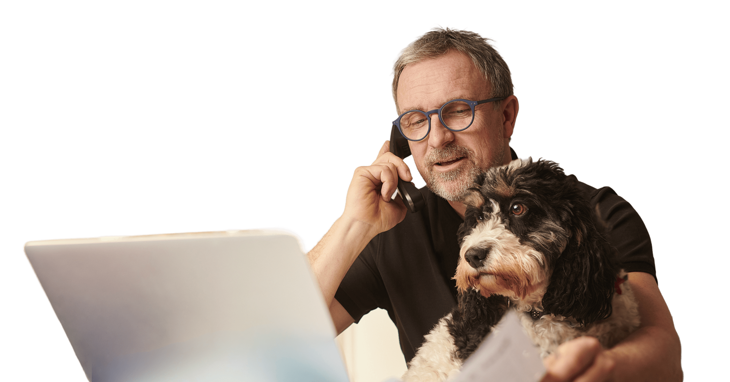 Man on computer with dog